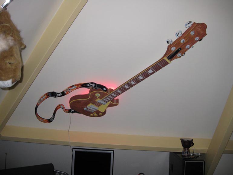 guitar mural on sloping ceiling
